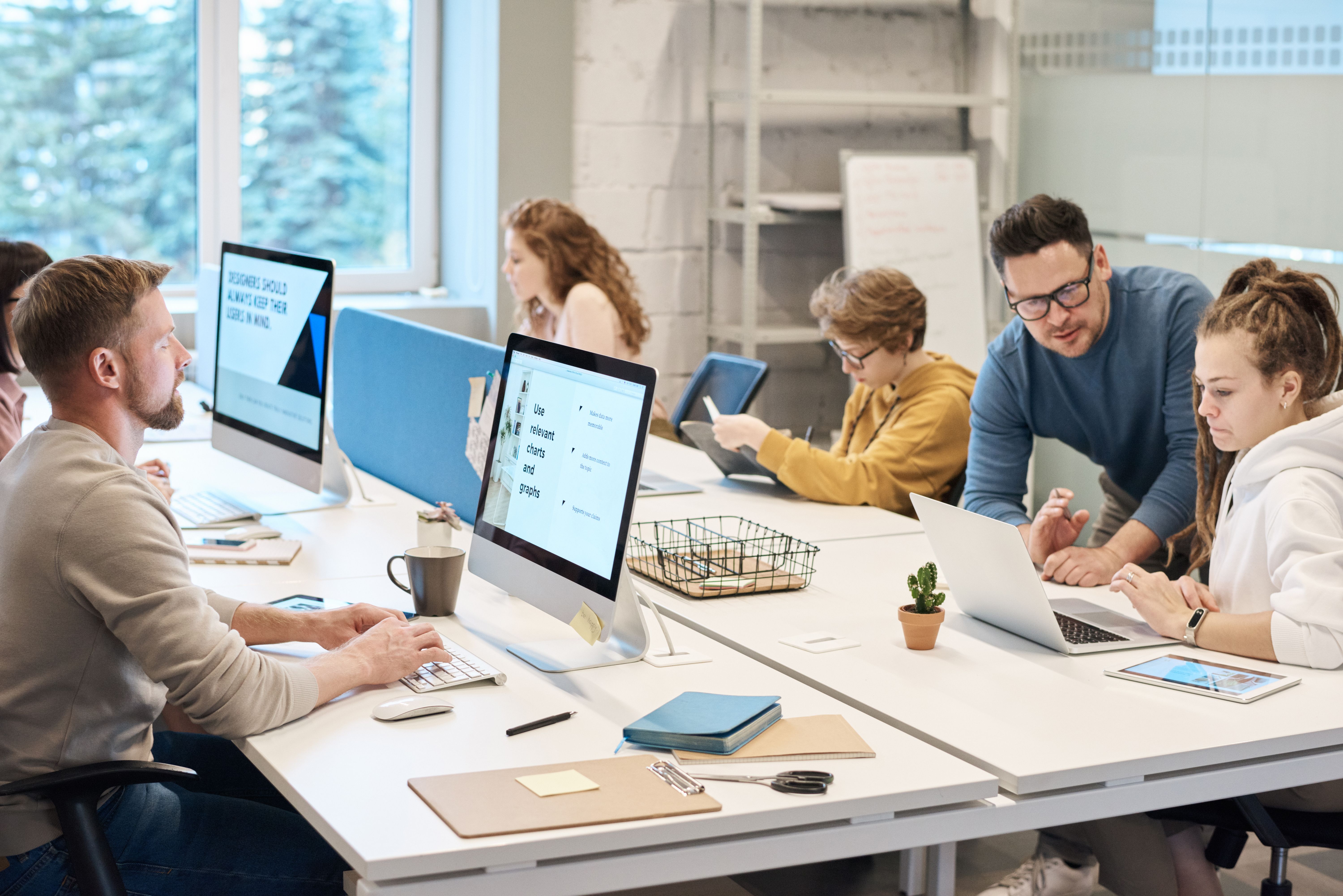 Team working together in front of a computer